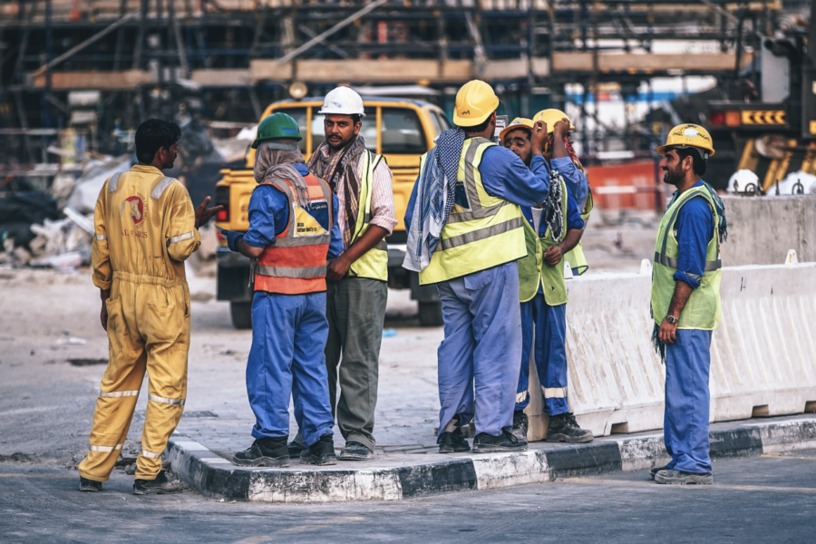 Group of construction workers standing together at jobsite