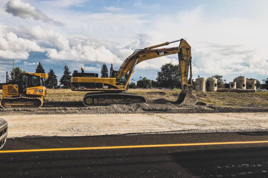 CAT excavator on jobsite scooping dirt