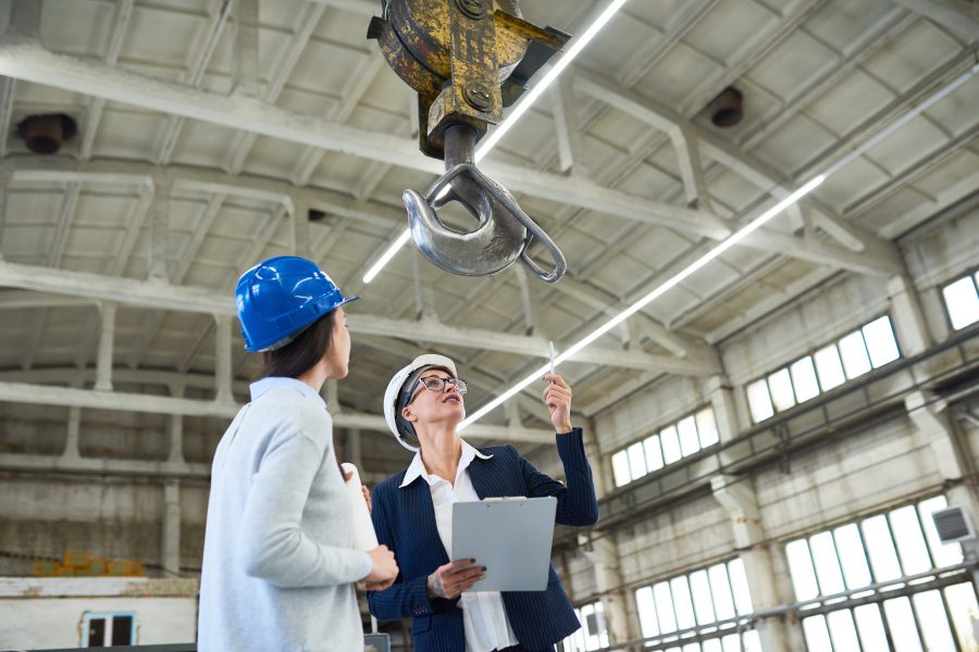 Construction workers interpreting fleet utilization data