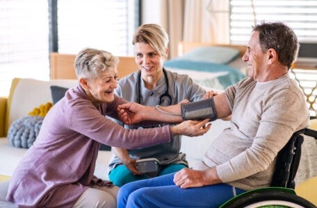 a healthcare worker visiting senior patient
