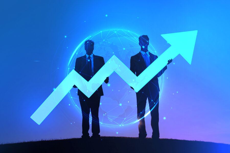 Two Businessmen holding the increase graph on the hill