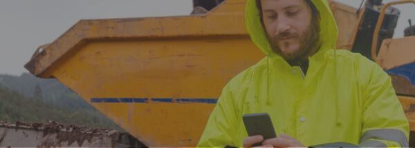 Rental employee using a mobile app on a phone