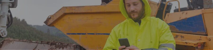 Rental employee using a mobile app on a phone