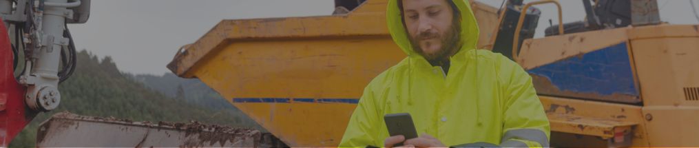 Rental employee using a mobile app on a phone
