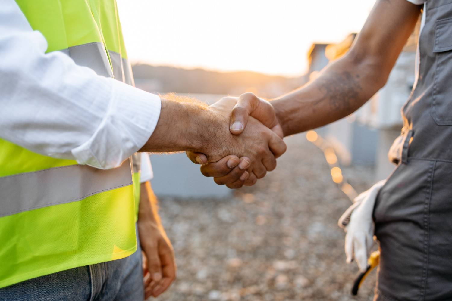 Rental provider and customer shaking hands