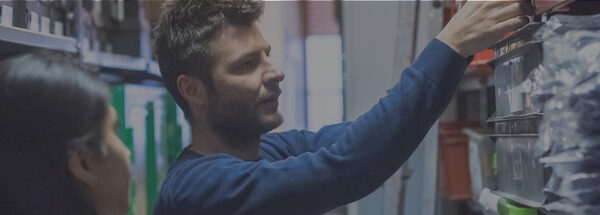 equipment rental employees conducting cycle counts of equipment rental inventory in the rental branch warehouse