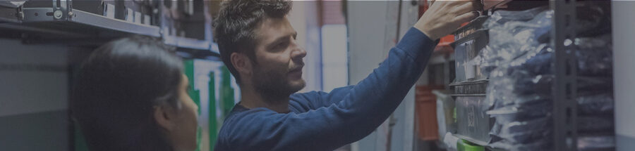 equipment rental employees conducting cycle counts of equipment rental inventory in the rental branch warehouse