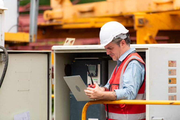 manager using rental inventory software to manage equipment rental inventory at a rental branch location